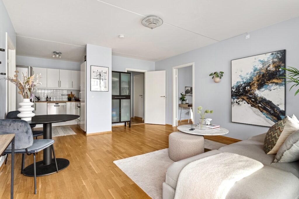 Photo by Lisa Anna A living room filled with furniture and a wooden floor